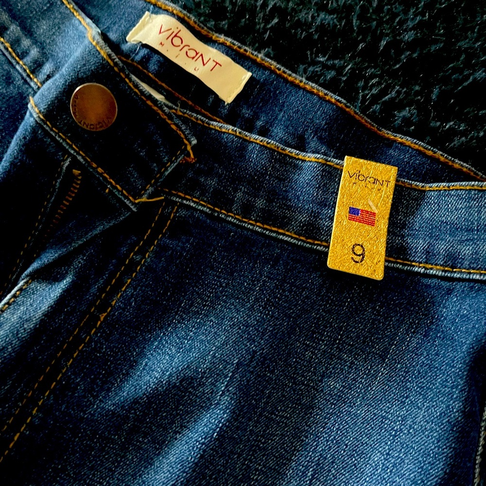 Dark wash bell bottom boot jeans.
